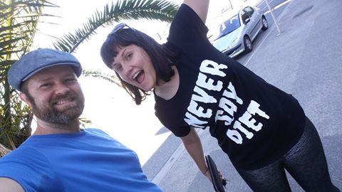 Photo is of two people smiling. One (me) is wearing a tshirt that says "Never Say Diet"